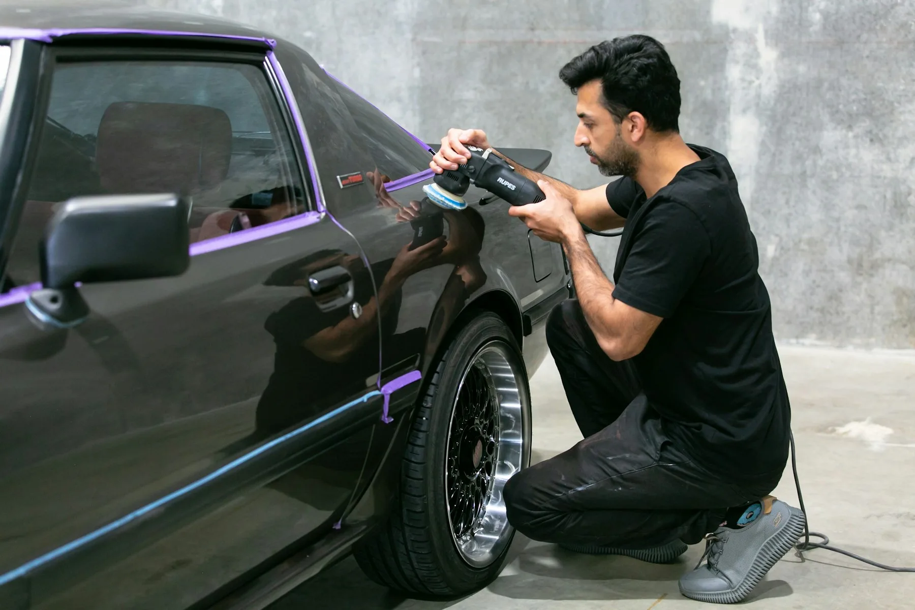 Machine polishing a car paint finish